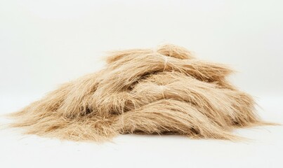 Fototapeta premium Pile of untied bundles of wheat straw, used for animal bedding or agricultural purposes.