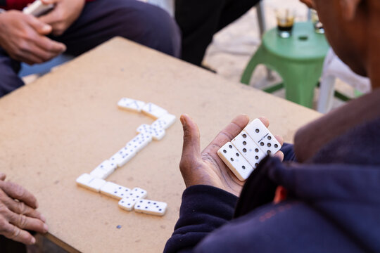 Tataouine, Tunisia. Men playing dominoes in the ancient Berber town of Ksar Ouled Soltane.