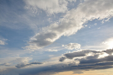 The sky is full of beautiful clouds and the sun is shining through the clouds