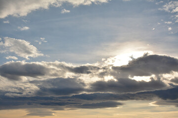 The sun's rays break through the clouds
