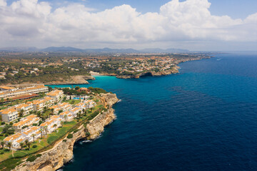 Fototapeta premium An aerial panoramic view on Cala Anguila shoreline on Mallorca island in the Mediterranean Sea