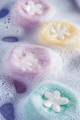 Colorful bath crystals create a soothing bubble bath experience for relaxation and self-care in a serene environment