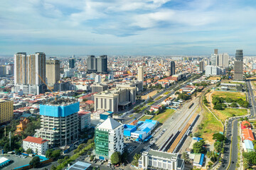 Modern office skyscrapers buildings with residential areas in rapidly developing Phnom Penh central...