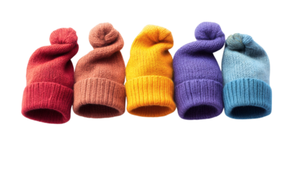 A set of colorful knitted hats with a large pom-pom on top, isolated against a white background.