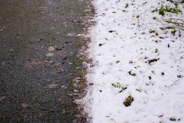Shoe footprints of a footpath covered with snow. Winter cold season. Night shot. Living through hard nature conditions concept. Nobody. Selective focus.