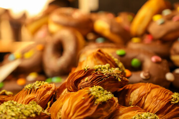 There is a fair in a town square in Italy selling Italian baked goods.
