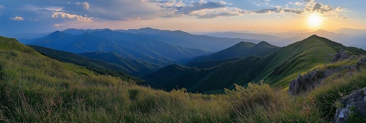 Fototapeta premium A breathtaking view of mountains under a colorful sunset sky.