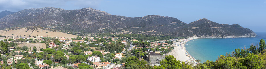 Extra wide Aerial view of Solanas with its beautiful beach with blue and turquoise water