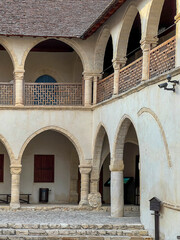 Naklejka premium The old town of Omodos in Cyprus with historic buildings, narrow streets with shops focused on selling regional souvenirs, arts and crafts