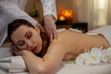 Experience a Relaxing Spa Massage that incorporates Hot Stones and beautiful Orchids