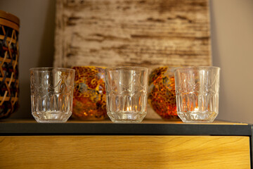 An Elegant Arranging of Beautiful Glassware Displayed on a Stylish and Modern Shelf