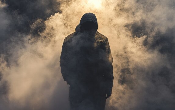 A shadowy dark figure of a man surrounded by smoke, evoking an ominous presence.