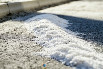 Strategies for minimizing salt usage on roads with brine solutions and salt mounds