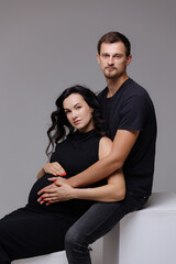 Expecting a new journey filled with love and anticipation in a modern studio setting