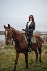 Obraz premium A person riding a horse in a field
