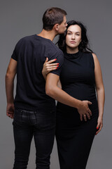 Fototapeta premium Joyful anticipation of parenthood captured in a tender moment between expecting couple