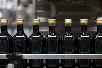 Vinegar bottles in a bottling line during the production process