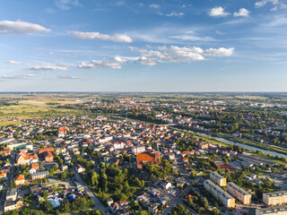 Summer skyline cityscape of Śrem, Wielkopolska, Poland at sunset. Wide aerial landscape view
