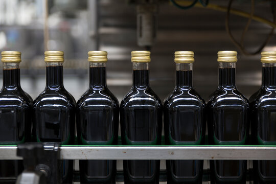 Vinegar bottles in a bottling line during the production process