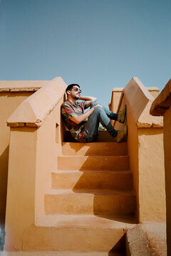 Man Sitting on Stairs