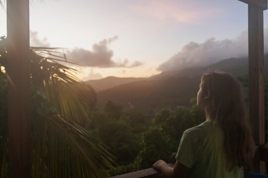 Girl Watching Sunset Over El Yunque Rainforest
