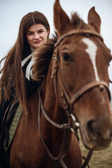 Fototapeta premium A person riding a horse in a field
