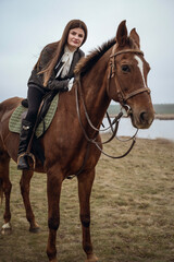Obraz premium A person riding a horse in a field