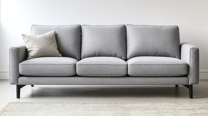 Stylish gray sofa with three cushions placed against a minimalist wall in a modern living room. Generative AI