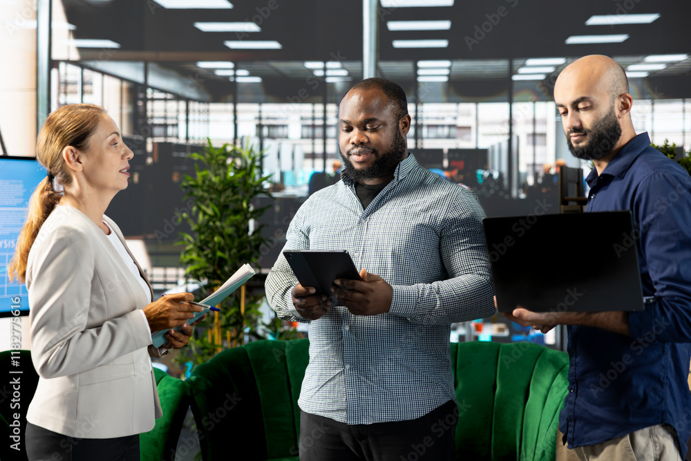 Poster manager with employees developing business strategies to improve operational profitability using lap