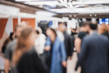 Abstract blurred people at exhibition hall of expo event trade show. Business convention show or job fair. Business concept background