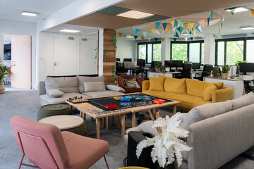 Cozy Co-Working Lounge With Puzzle Table and Colorful Sofas