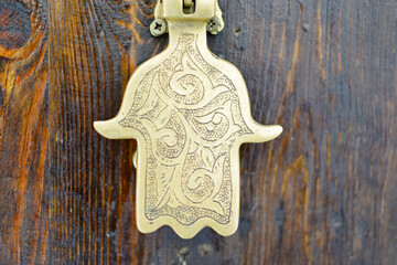 Fatima hand golden door knob at Marrakech medina and souk
