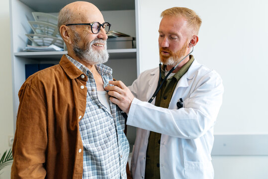 The doctor listens to the patient using a stethoscope