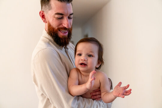 dad holding baby