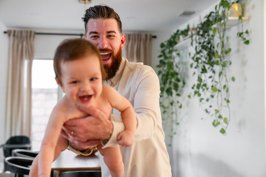father playing with baby 