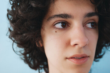 Closeup portrait of natural woman with curly hair