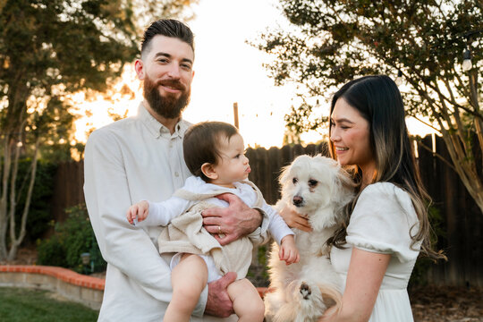 Young family portrait dog