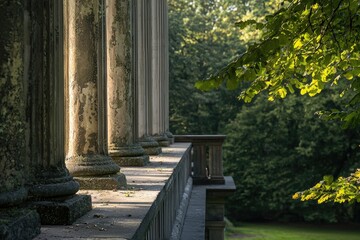 Fototapeta premium Stone pillars stand in a row near green trees on a summer day, for an outdoor scene.