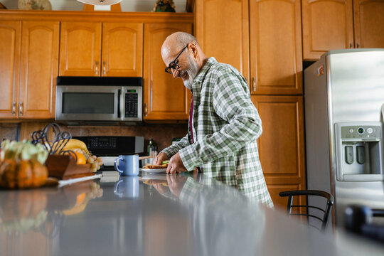 The man is going to eat at home