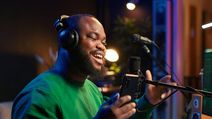 Songwriter singing new song on his microphone to produce new tracks for music industry, home studio...