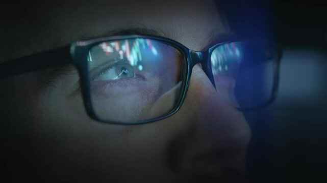Computer Glasses Reflecting Stock Market Data Dark Room Blue Light Technology