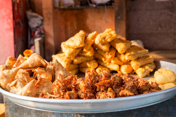 India, Mumbai. Sidewalk food stall, Indian snack, fast food.