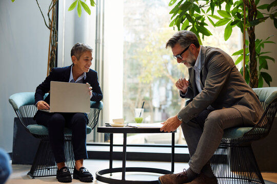 Colleagues doing business at the cafe