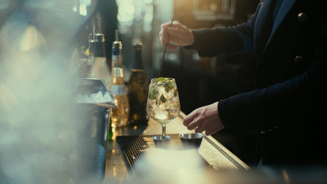Bartender stirring drink