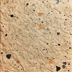 a sealess patter of recycled kraft paper with small specs of black and gray