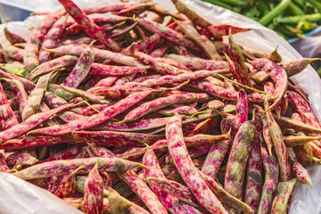 Shamwari, Srinagar, Jammu and Kashmir, India. Fava bean pods for sale at a market in Kashmir.