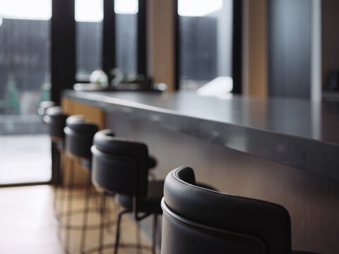 Modern kitchen design features sleek bar seating