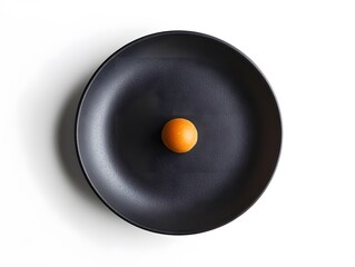 Single Orange Sphere on Black Plate: Minimalist Culinary Still Life