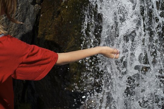 Touching nature's pure water flow