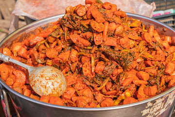 Rainawari, Srinagar, Jammu and Kashmir, India. Cooked lotus root for sale at a market.
